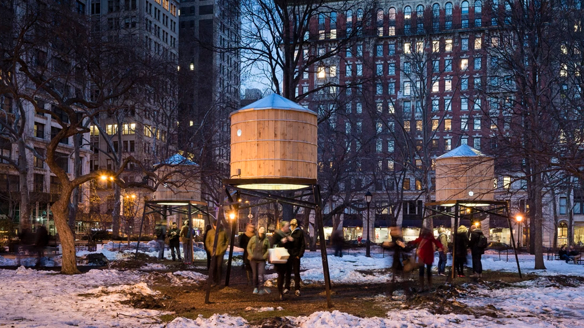 Public art installation in a New York park at dusk.
